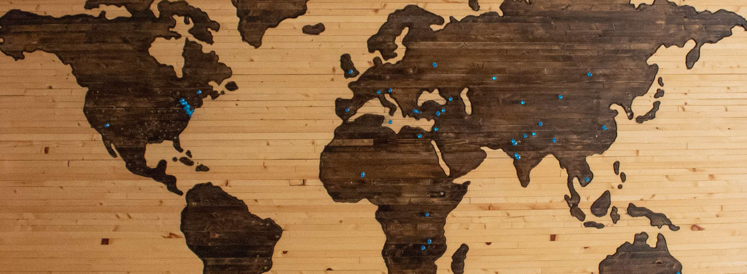 world map with pins to signify reach and using targeted notifications for better conversions